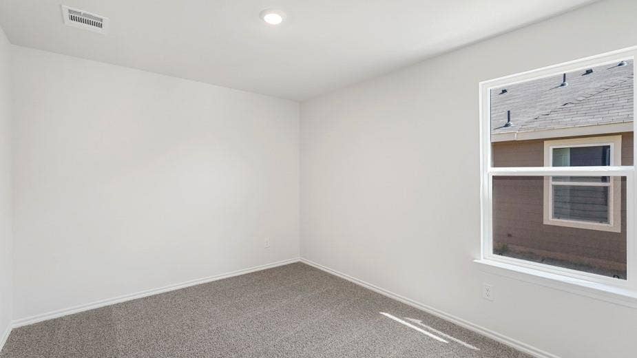 708 Rock Point Road, Josephine, TX 75135 Recessed ceiling lighting, large window, neutral wall paint, and gray carpet