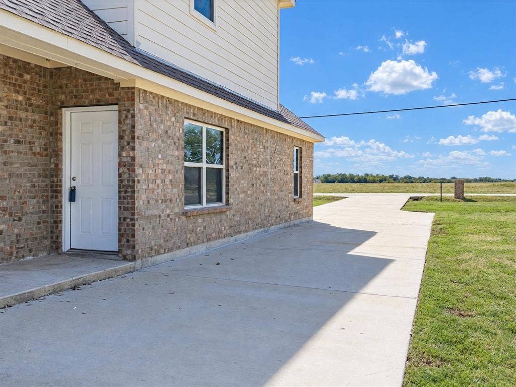 2312 Rogers Avenue, Lancaster, TX 75134 Back Patio opening to large grass backyard