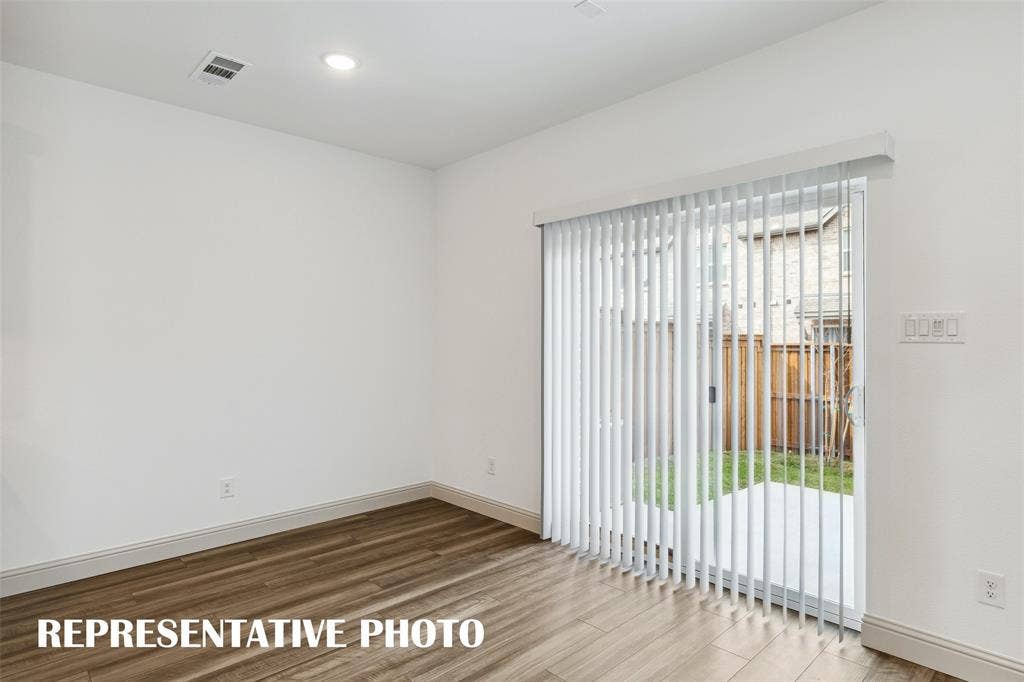 Your new dining room features a sliding glass door that leads out to the patio with fenced back yard!  REPRESENTATIVE PHOTO