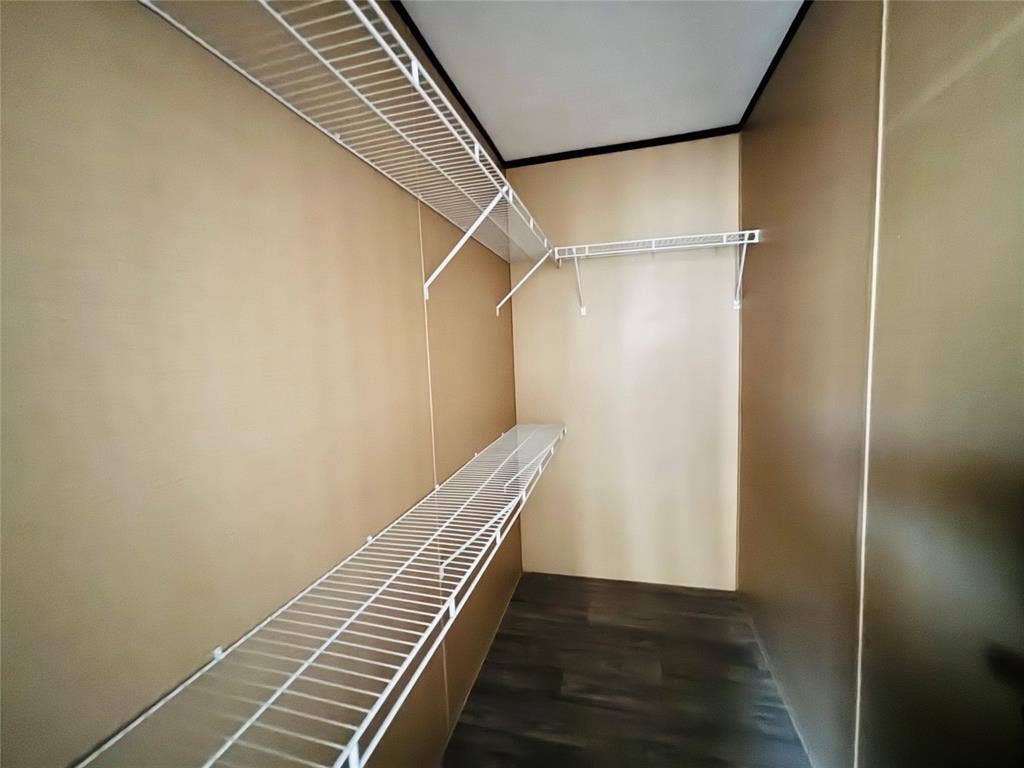 14311 Skyfrost Drive, #116, Dallas, TX 75253 Storage space featuring white wire shelving and wood-finish flooring