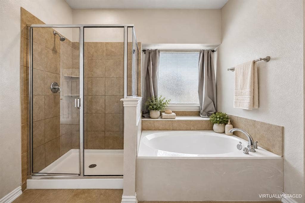Dual sinks, spacious and separate shower, separate water closet, linen closet and dual sinks.