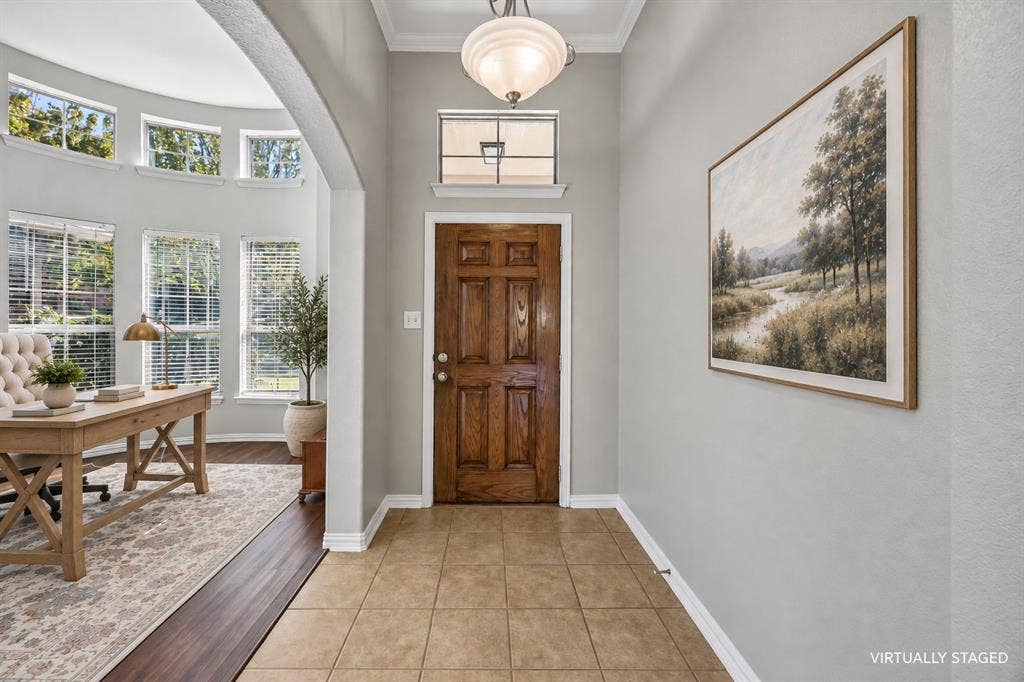 Upon entry you're greet with this office or sitting room.