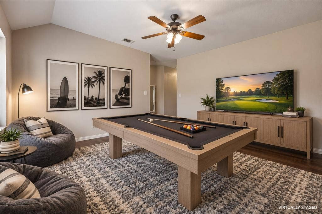 The 2 secondary bedrooms are divided by this oversized gameroom.