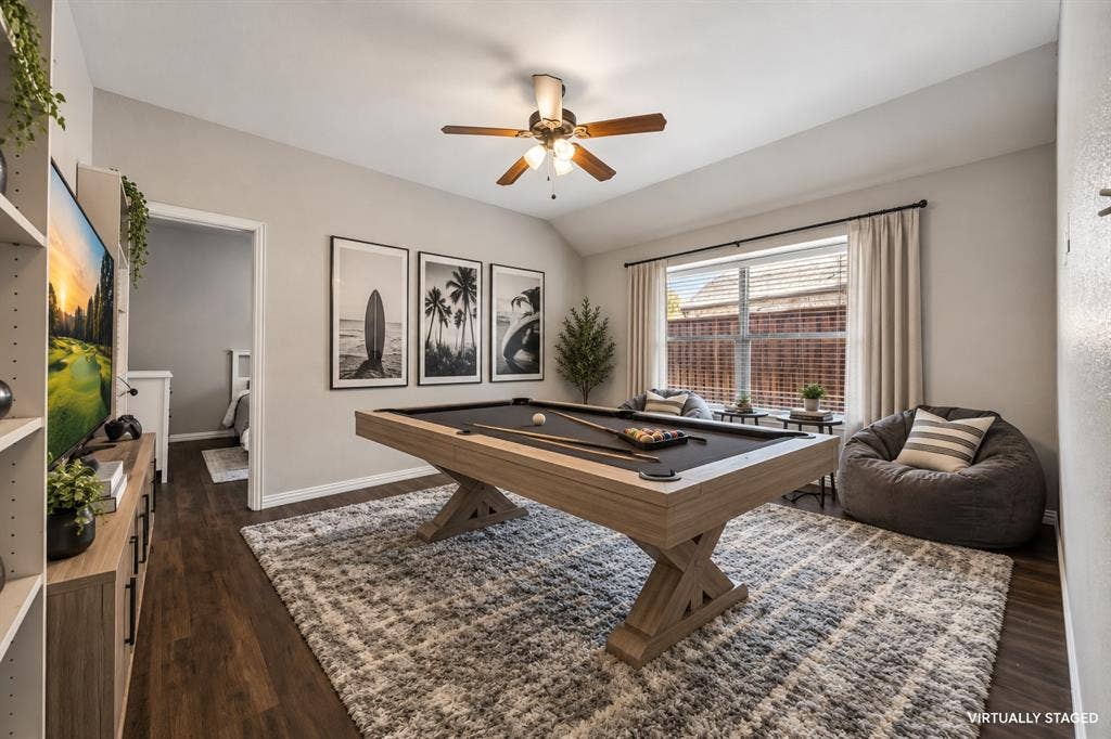 The 2 secondary bedrooms are divided by this oversized gameroom.