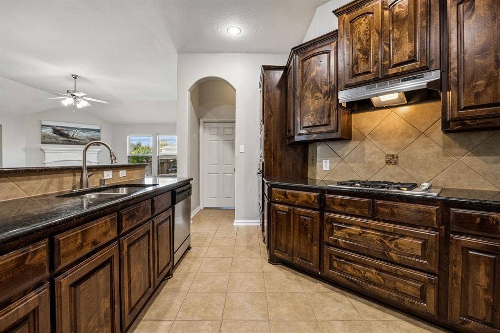 Spacious granite counter space and cabinets galore.