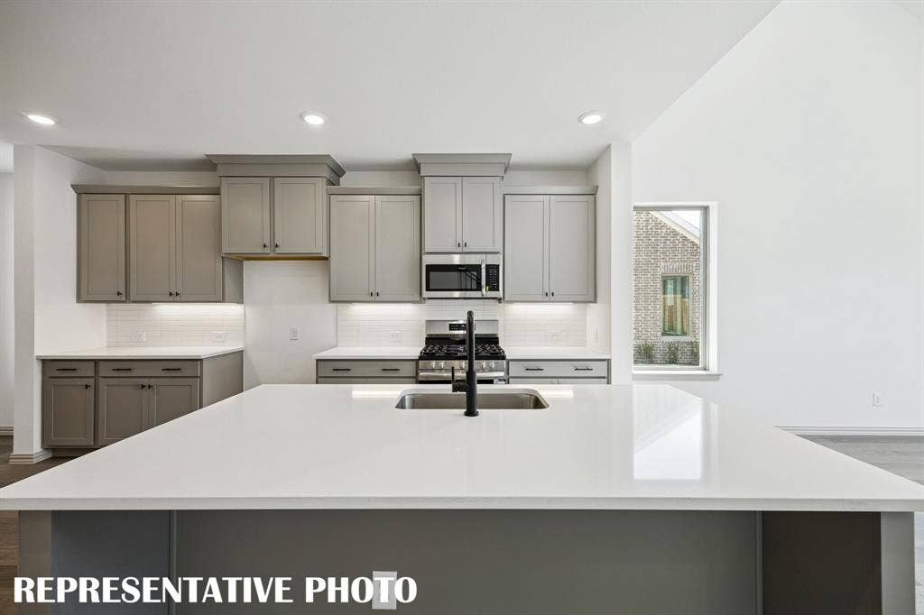 3567 Pierce Lane, Grand Prairie, TX 75052 Friends and family will love gathering round this beautiful kitchen island! REPRESENTATIVE PHOTO