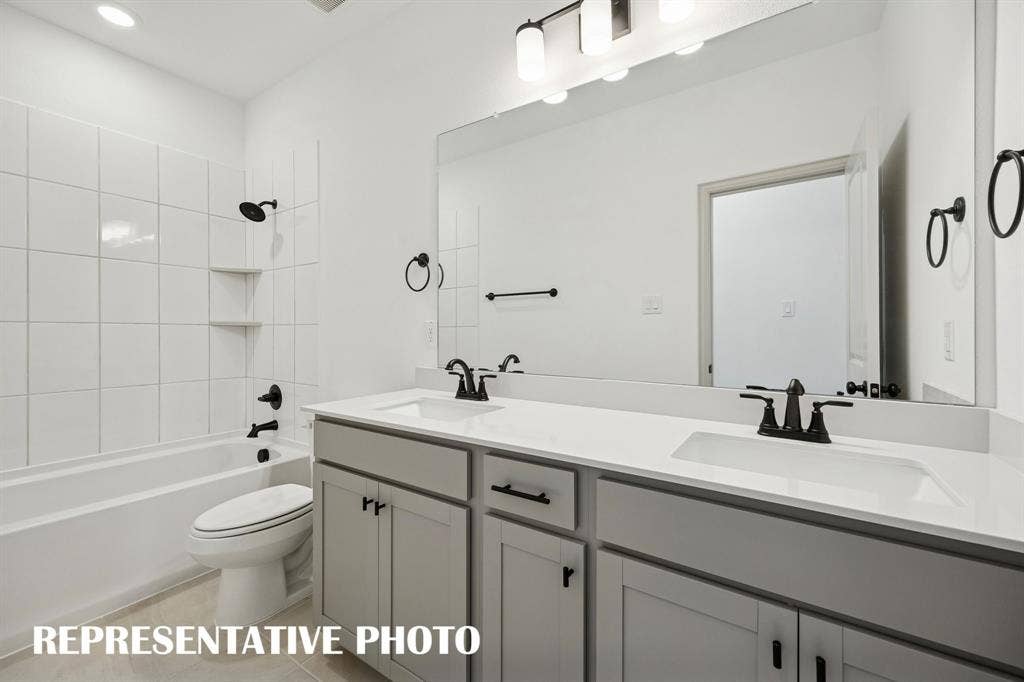 3567 Pierce Lane, Grand Prairie, TX 75052 With vanity space for two, friends and family will feel right at home in this guest bath. REPRESENTATIVE PHOTO