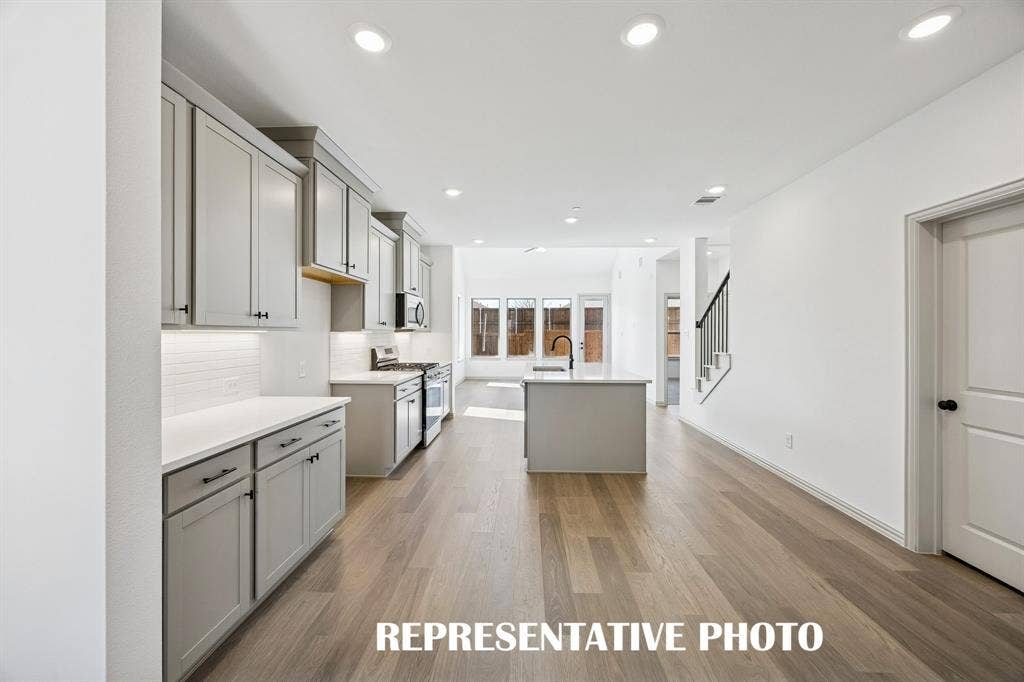3567 Pierce Lane, Grand Prairie, TX 75052 Featuring sight lines from the front through to the rear of the home, you'll enjoy welcoming family and friends into your new lock and leave dream home! REPRESENTATIVE PHOTO