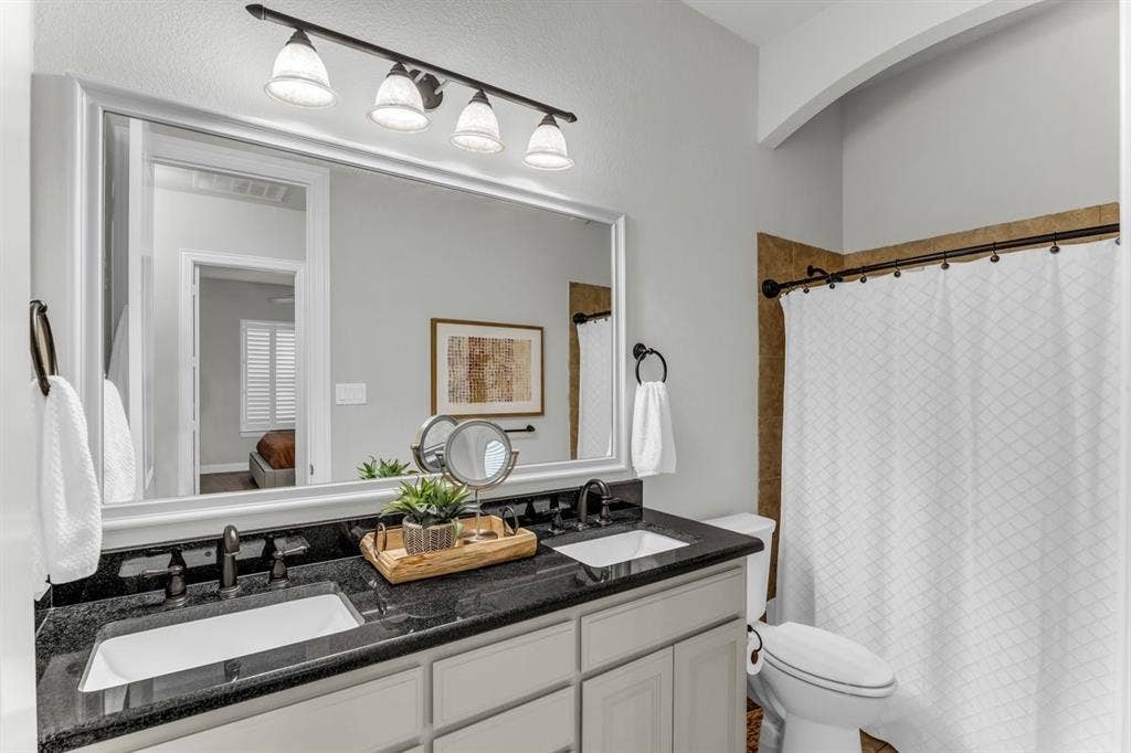 17050 Dominion Drive, Woodway, TX 76712 Dual vanity, bathroom located by secondary bedrooms