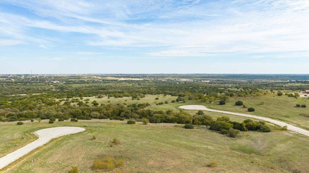 3337 Bounty Drive, Cresson, TX 76035 Expansive unimproved acreage featuring rolling topography, native vegetation, and paved cul-de-sac access