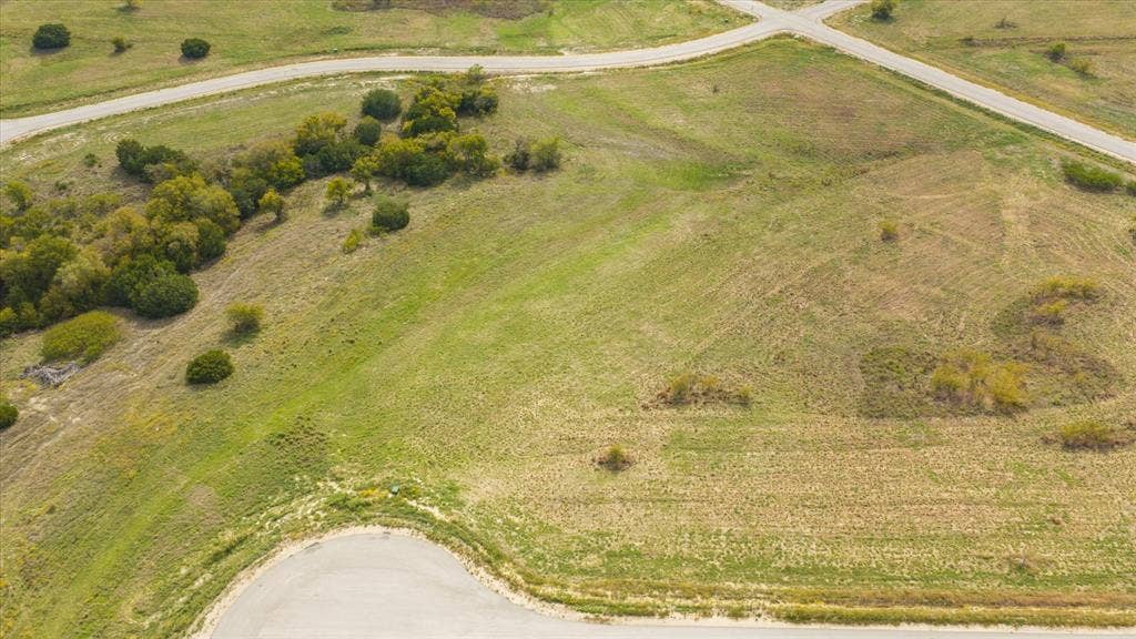 3337 Bounty Drive, Cresson, TX 76035 Expansive undeveloped acreage featuring topography variations, clusters of mature trees, and direct paved road frontage