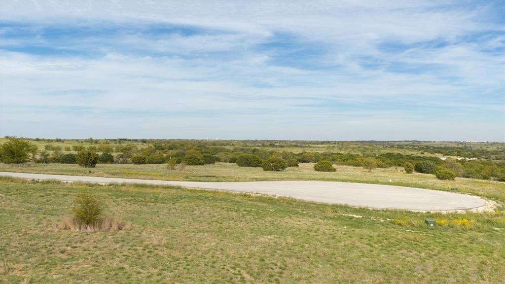 3337 Bounty Drive, Cresson, TX 76035 Expansive acreage featuring native grasslands, mature trees, and a paved cul-de-sac