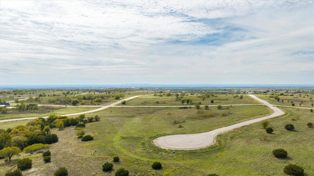 3337 Bounty Drive, Cresson, TX 76035 Expansive vacant land featuring rolling terrain, paved cul-de-sac access, and mature trees