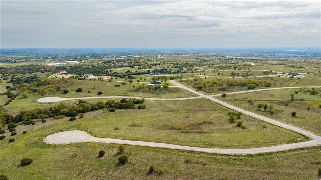 3337 Bounty Drive, Cresson, TX 76035 Expansive landscape featuring rolling topography, established roadways, and native vegetation