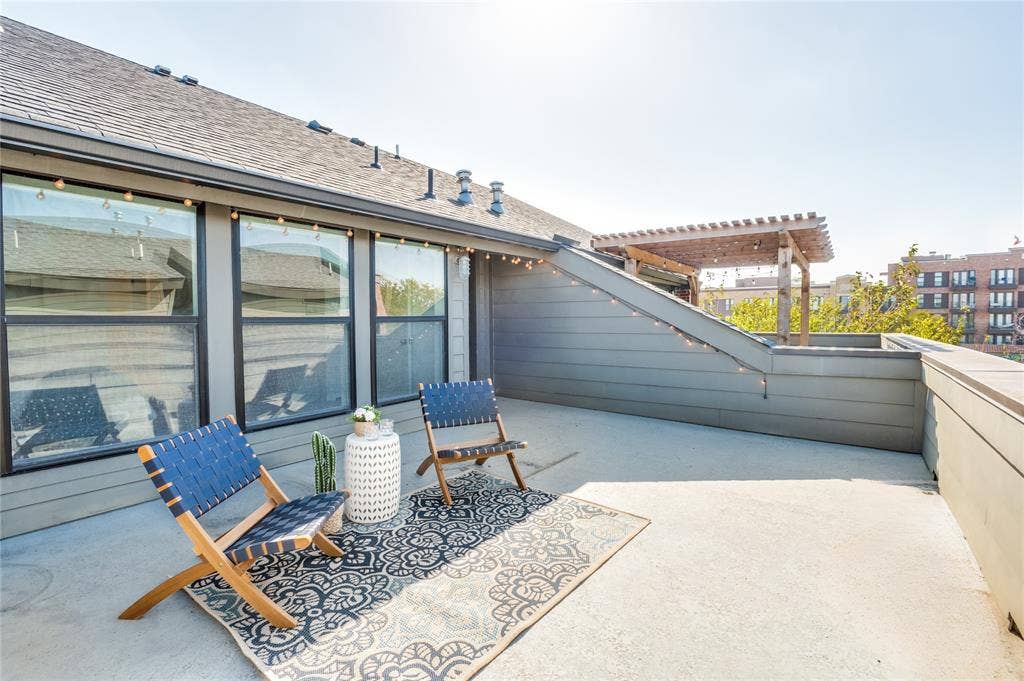 614 Finley Court, Dallas, TX 75208 Expansive rooftop terrace featuring horizontal wood-style siding, a wooden pergola, and large picture windows
