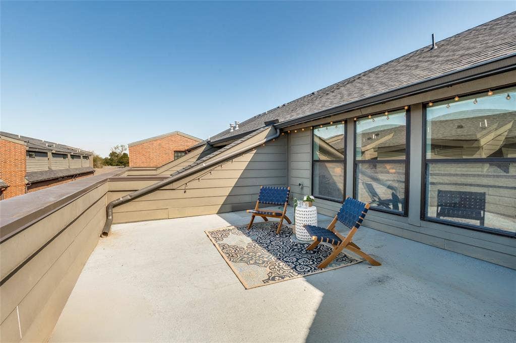 614 Finley Court, Dallas, TX 75208 Elevated terrace featuring horizontal siding, expansive windows, and a metal railing