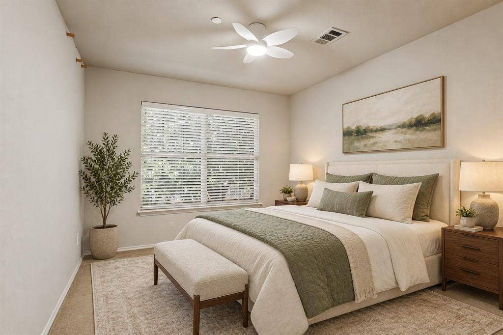 Bedroom featuring neutral wall paint, multi-pane window with horizontal blinds, and a multi-blade ceiling fan with integrated lighting