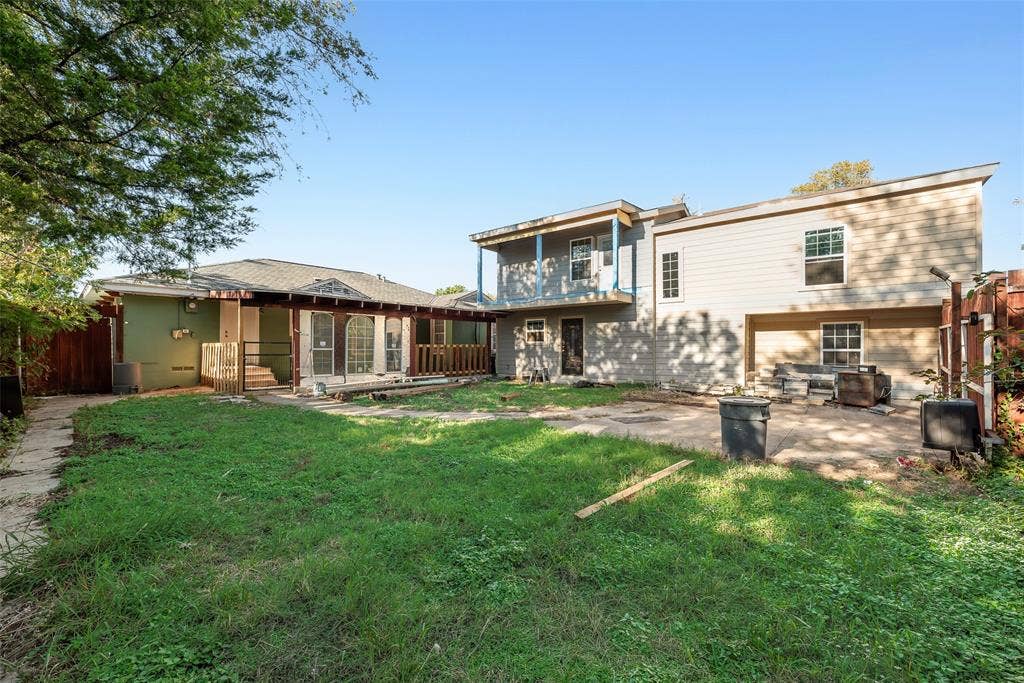 1572 Gillette Circle, Dallas, TX 75217 Backyard featuring a concrete patio, a covered pergola, a second-story deck, and horizontal siding