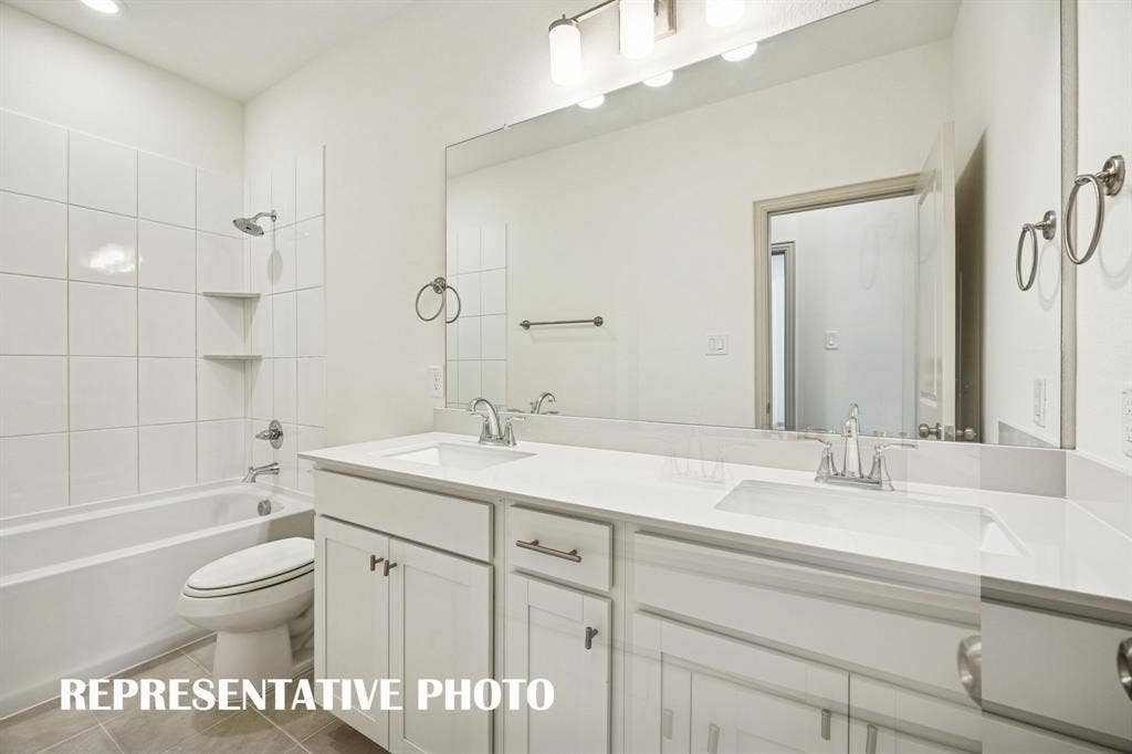 3574 Pierce Lane, Grand Prairie, TX 75052 Friends and family will enjoy their own vanity space in this thoughtfully designed guest bath. REPRESENTATIVE PHOTO