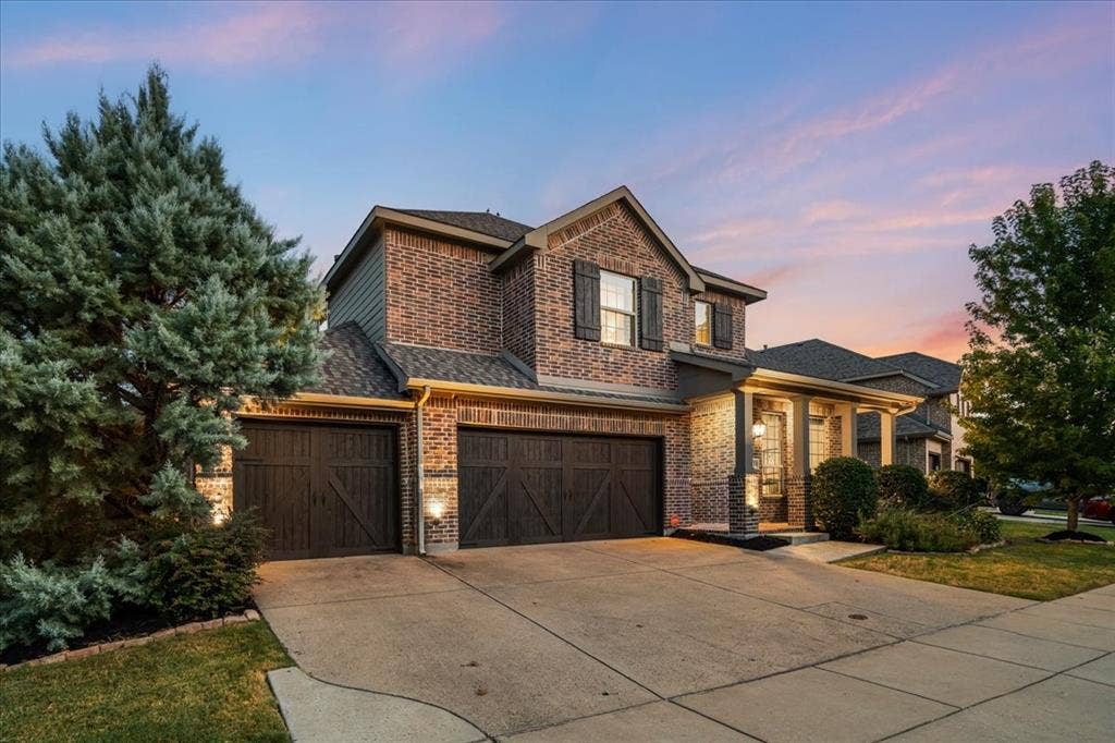 3 car garage and beautiful exterior lighting