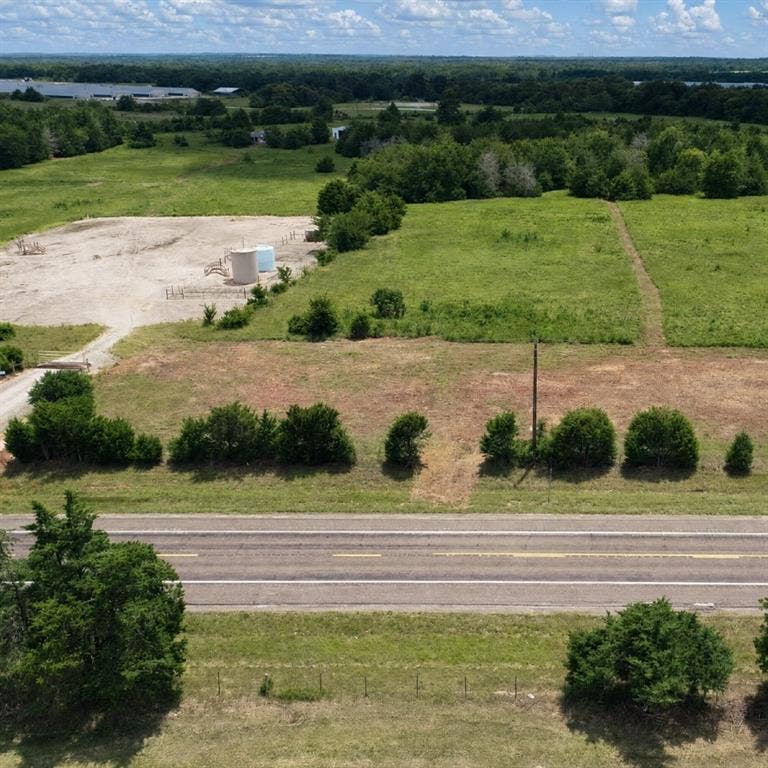 Lot 1 Morgan Road, Italy, TX 76651 Expansive acreage featuring cleared level terrain, mature tree lines, and paved road frontage