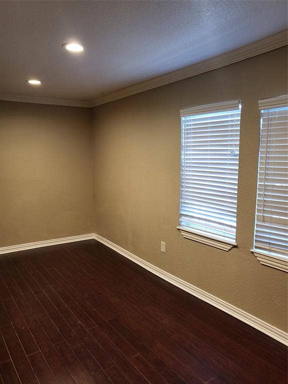 2705 Tanner Street, Dallas, TX 75215 Interior space featuring dark wood-finish flooring, crown molding, recessed lighting, and dual windows with horizontal blinds