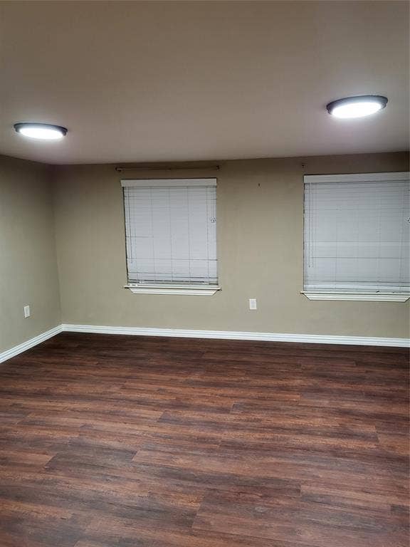 2705 Tanner Street, Dallas, TX 75215 Wood-finish flooring, neutral wall tones, two dual-pane windows, and recessed ceiling lighting