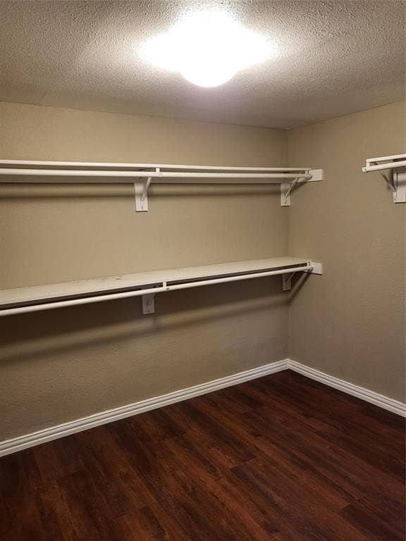 2705 Tanner Street, Dallas, TX 75215 Storage space featuring dual-level metal shelving and wood-finish flooring