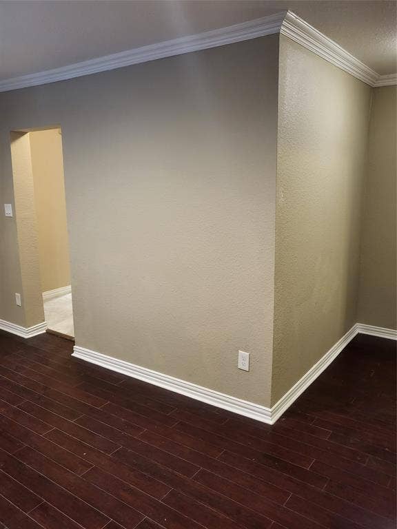 2705 Tanner Street, Dallas, TX 75215 Dark wood-finish flooring complemented by white crown molding and neutral wall paint