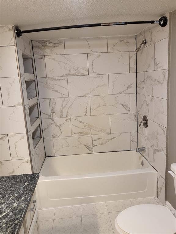2705 Tanner Street, Dallas, TX 75215 Bathtub surround featuring large-format neutral-toned tile with veining, integrated wall shelving, and metal shower fixtures