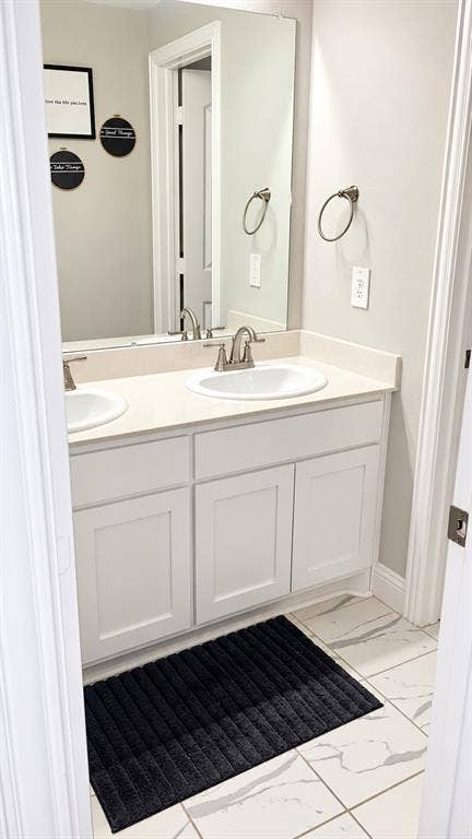 301 Delaford Drive, Forney, TX 75126 Secondary bathroom with a white vanity and clean, neutral finishes.