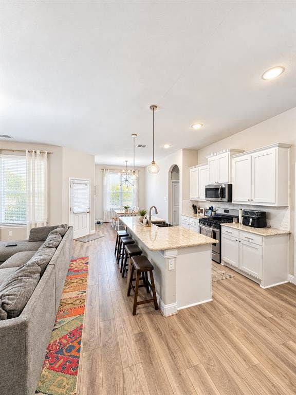 301 Delaford Drive, Forney, TX 75126 Open sightlines from the kitchen to the dining and living areas make everyday living and entertaining easy.