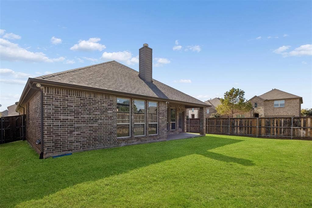 15501 Governors Island Way, Prosper, TX 75078 Backyard with wood fence