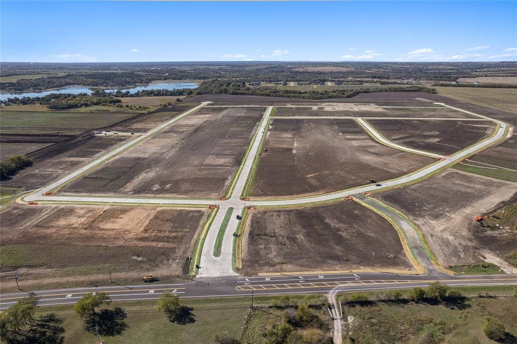 109 Devi Drive, Waxahachie, TX 75165 Cleared acreage featuring paved infrastructure, concrete curbing, and established roads