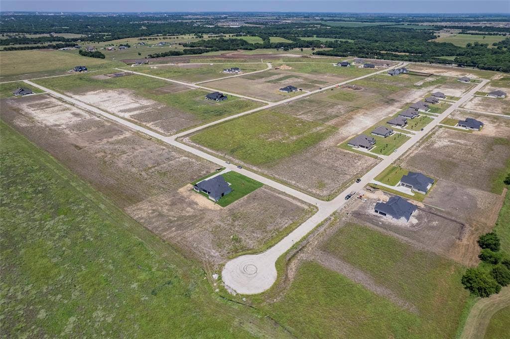 109 Devi Drive, Waxahachie, TX 75165 Aerial perspective of a development featuring paved cul-de-sac streets, cleared residential lots, and established asphalt roadways