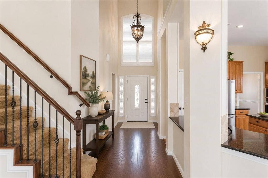12004 Paducah Drive, Frisco, TX 75035 Grand two-story entry with sweeping staircase, gleaming wood floors and abundant natural light.