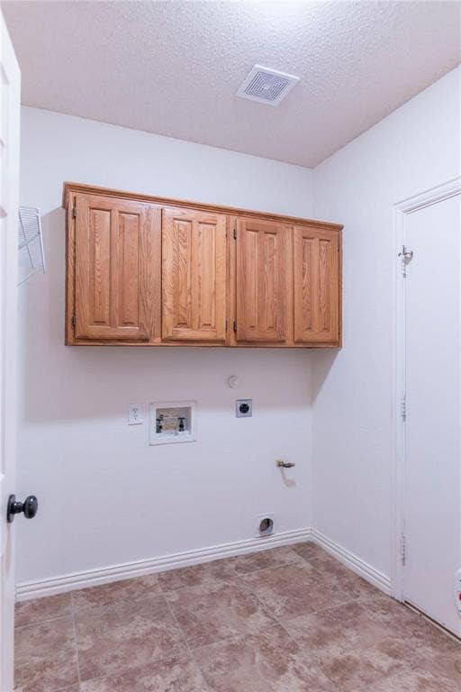 12004 Paducah Drive, Frisco, TX 75035 Dedicated laundry room with built-in cabinets for extra storage.