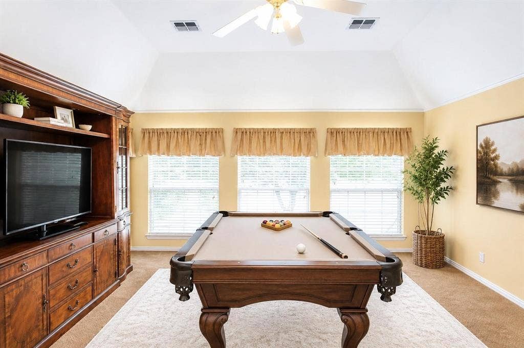 12004 Paducah Drive, Frisco, TX 75035 Spacious game room with built-ins and big windows - room for movie nights, hobbies or a home gym. Virtually staged.