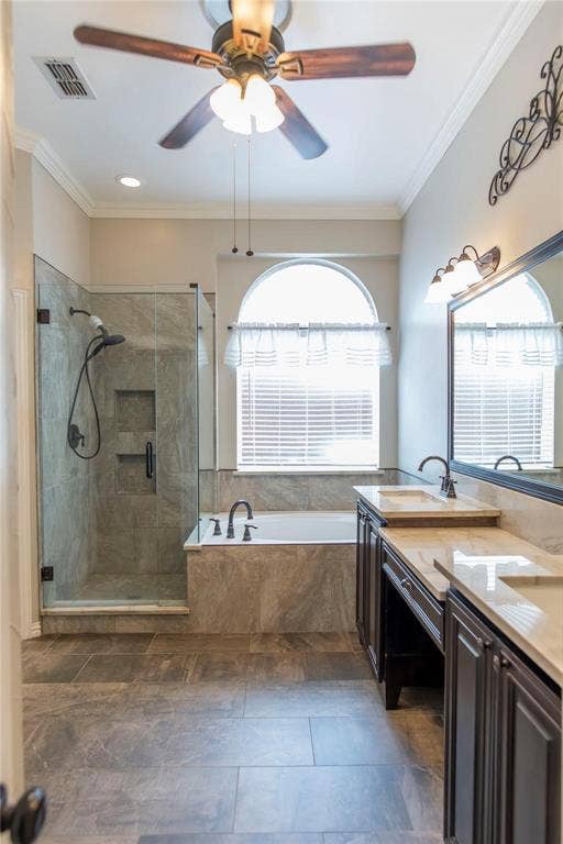 12004 Paducah Drive, Frisco, TX 75035 Bright bath with dual vanities, ceiling fan and natural window light.