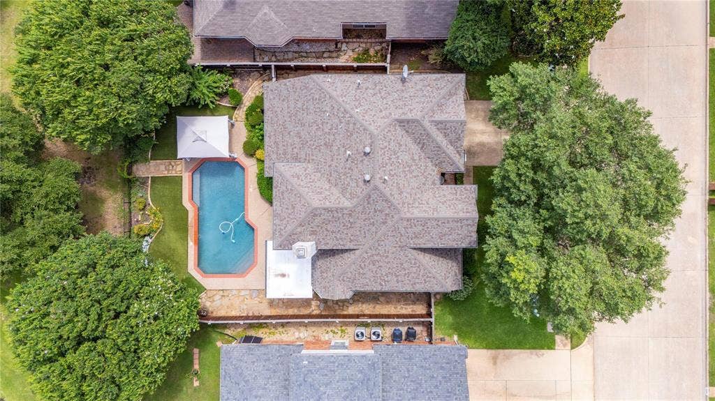 12004 Paducah Drive, Frisco, TX 75035 Aerial view showcasing the private pool, mature trees and golf course setting in Plantation Resort.