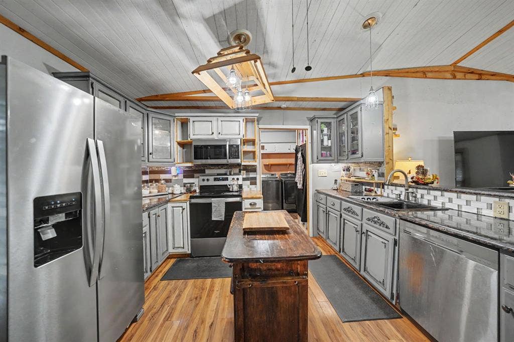 2415 Fannin Street, Greenville, TX 75401 Kitchen featuring ample cabinet space and a center island for added prep space and functionality.