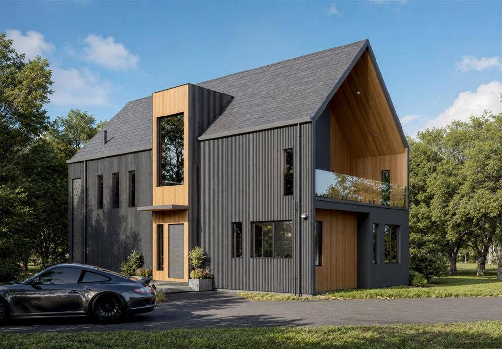 1721 Private Road 5312, McKinney, TX 75071 Contemporary exterior featuring a mix of dark vertical siding and wood-tone accents, a steep-pitched gable roof, a recessed upper-level balcony with a glass railing, and vertical rectangular windows
