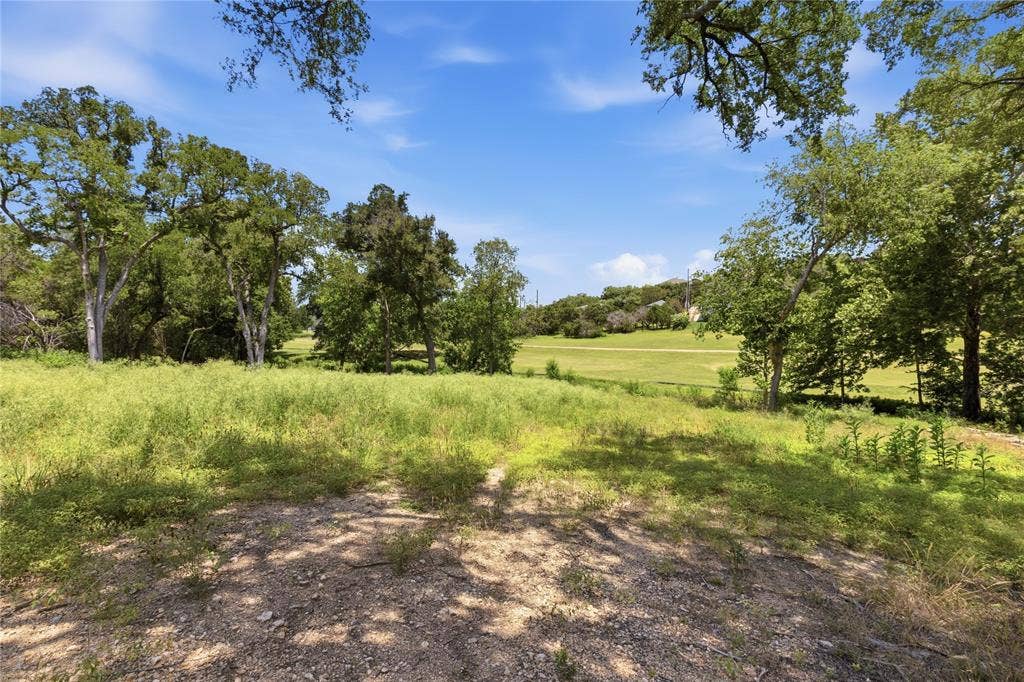 Expansive parcel featuring mature oak trees, open meadow space, and native grasses
