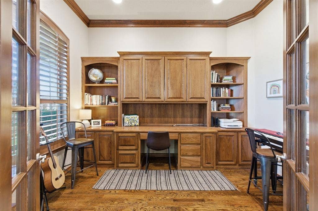 3714 Cove Timber Avenue, Granbury, TX 76049 Dedicated office space with beautiful built-in desk and shelfs. Lake views right outside the window.