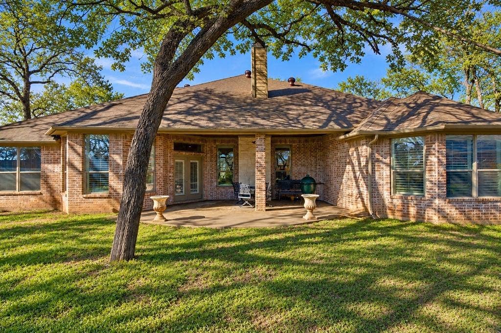 3714 Cove Timber Avenue, Granbury, TX 76049 AI enhanced for grass.