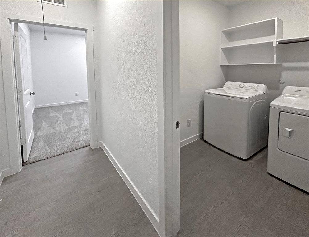 2504 Clyde Road, Celina, TX 75009 Laundry room featuring luxury vinyl plank flooring, built-in shelves, and white interior trim
