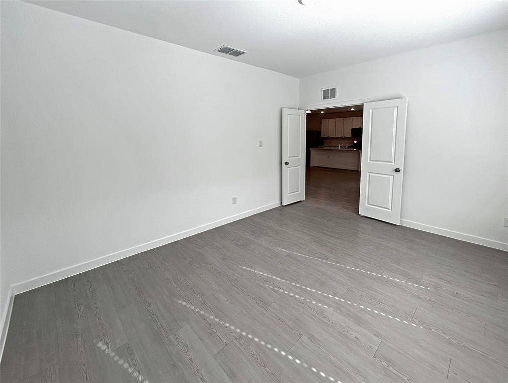 2504 Clyde Road, Celina, TX 75009 Neutral interior space featuring luxury vinyl plank flooring and two-panel interior doors