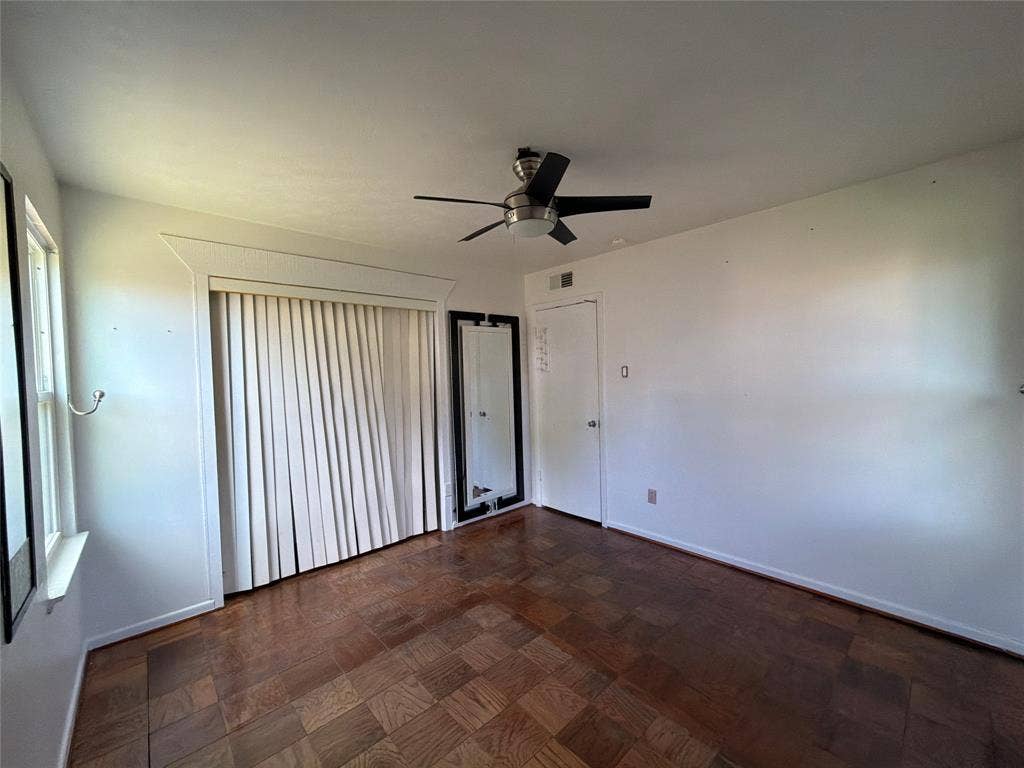 1819 Finley Road, Irving, TX 75062 Parquet wood-finish flooring, ceiling fan with integrated lighting, and window casing