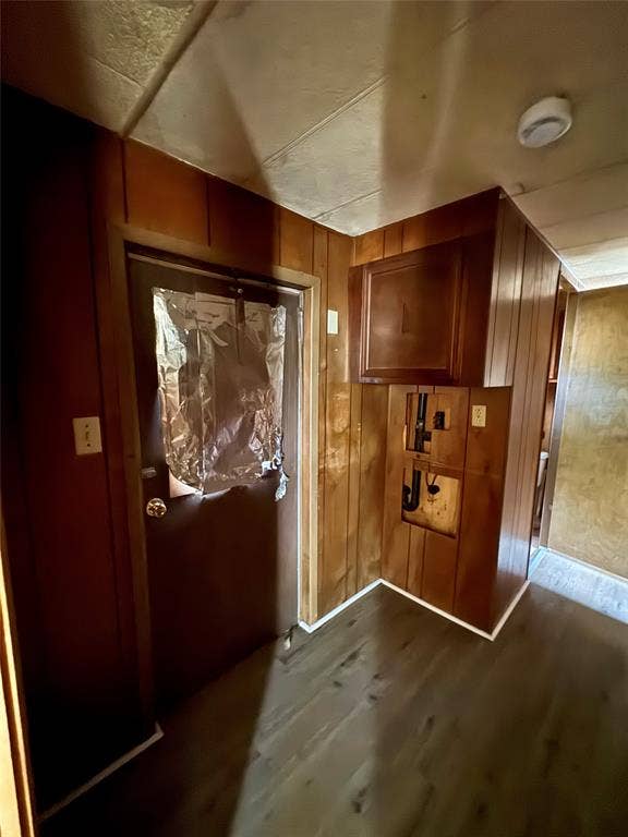 Wood-finish wall paneling, ceiling tiles, and wood-finish flooring
