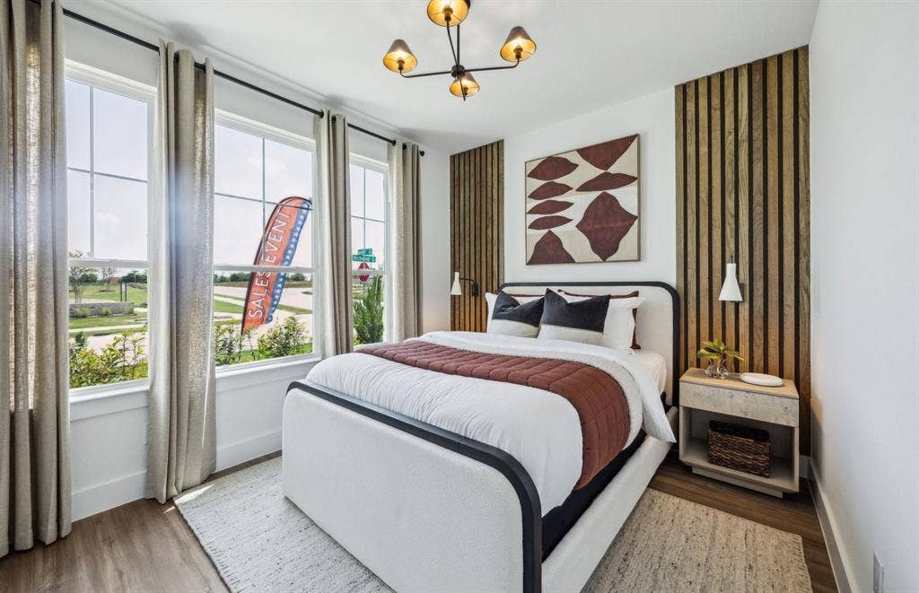 *Model Representation - Spacious secondary bedroom with large windows